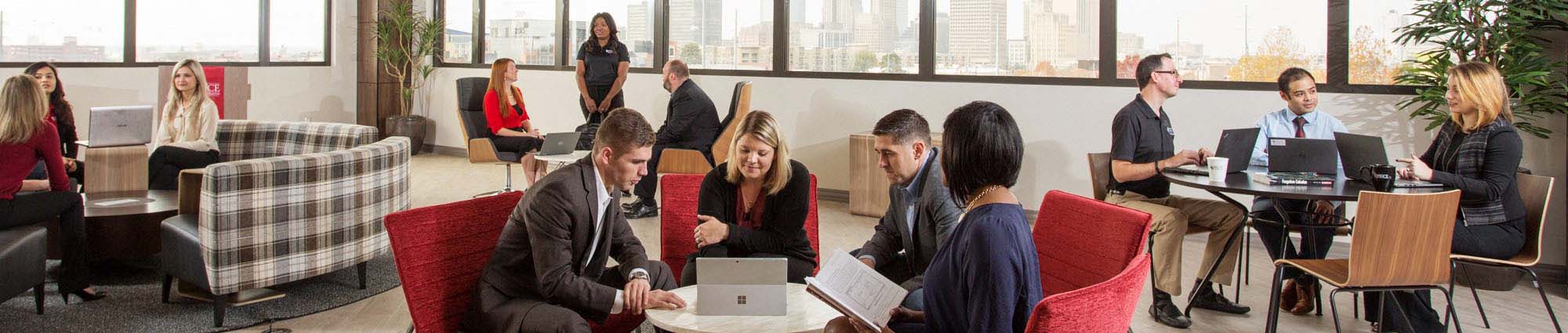 Students and faculty gather at the Gene Rainbolt Graduate School