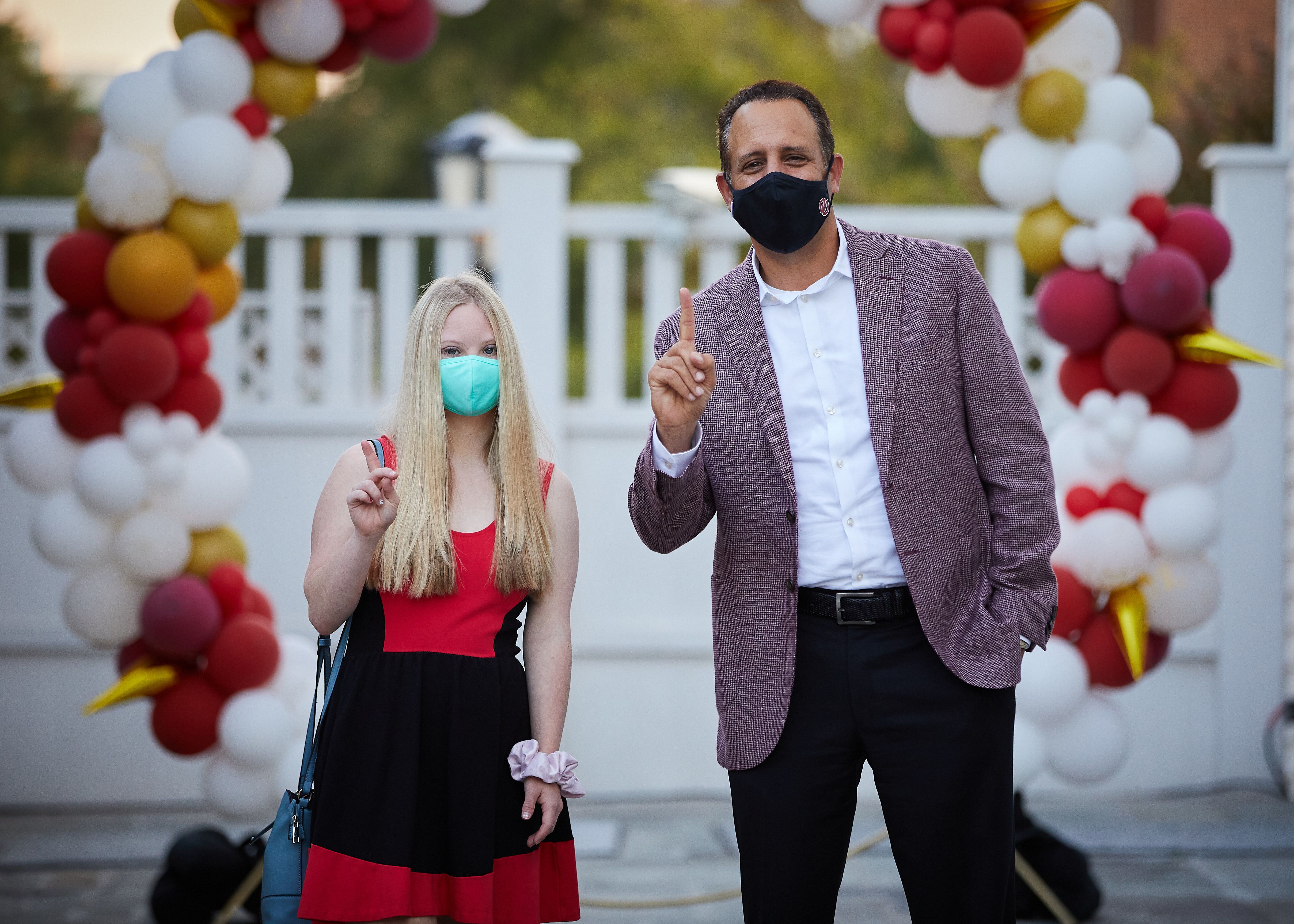 PLC Student Candace Moffitt posing outside with OU President Joseph Harroz wearing masks in response to the pandemic.