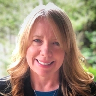 Picture of Denise Davis in a dark blazer 