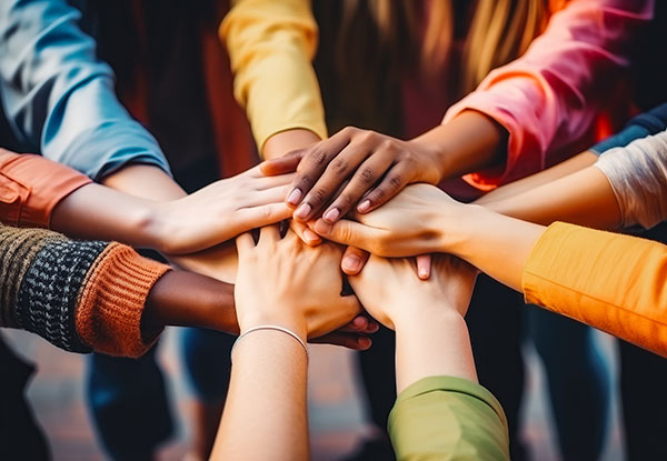 Many hands coming together