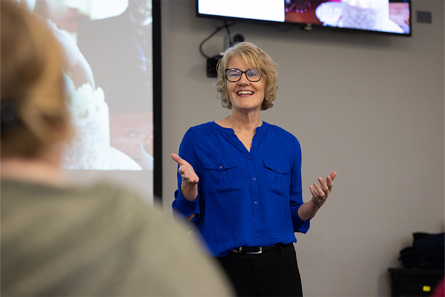 Professor speaking to class. 