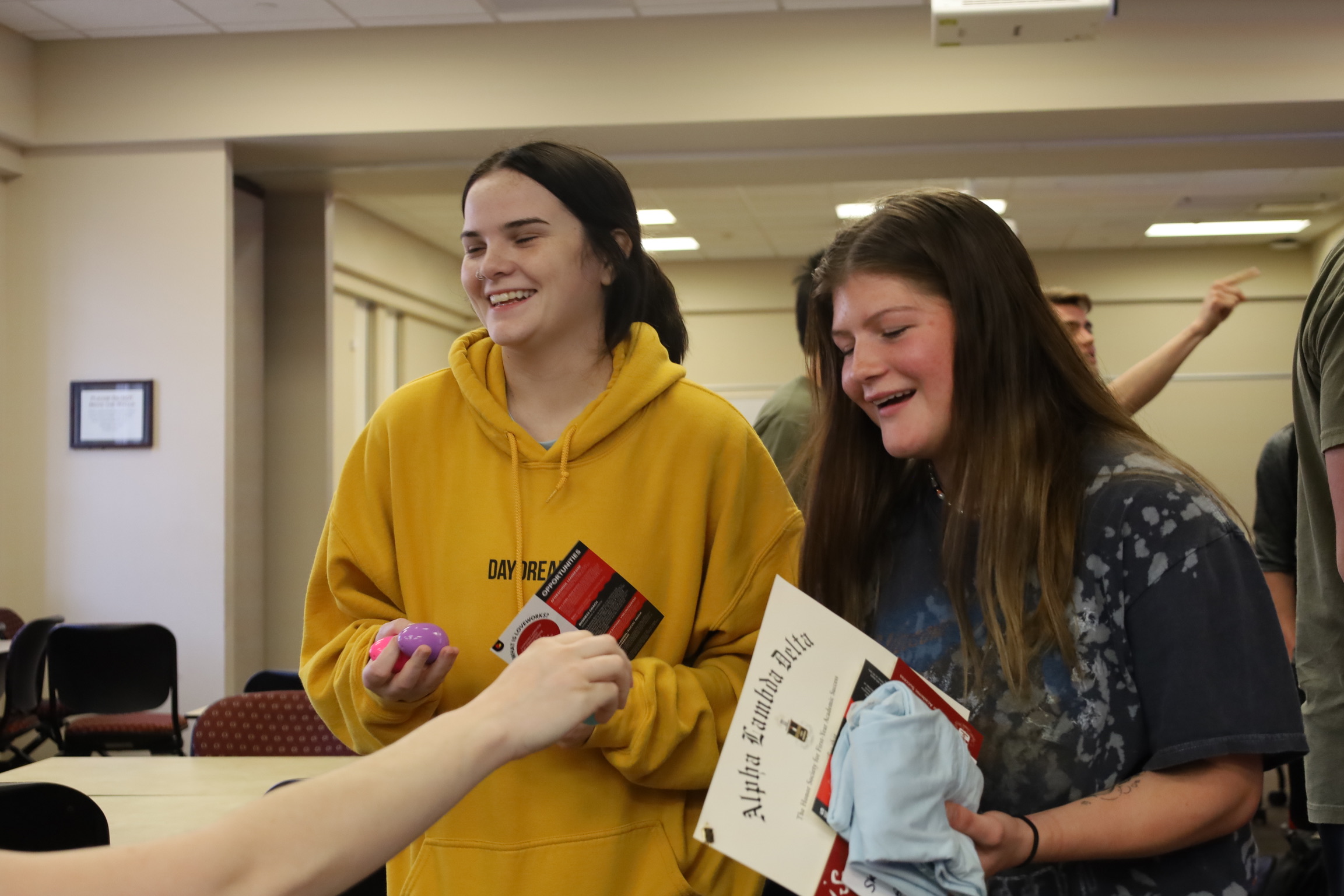 Students receiving items from event