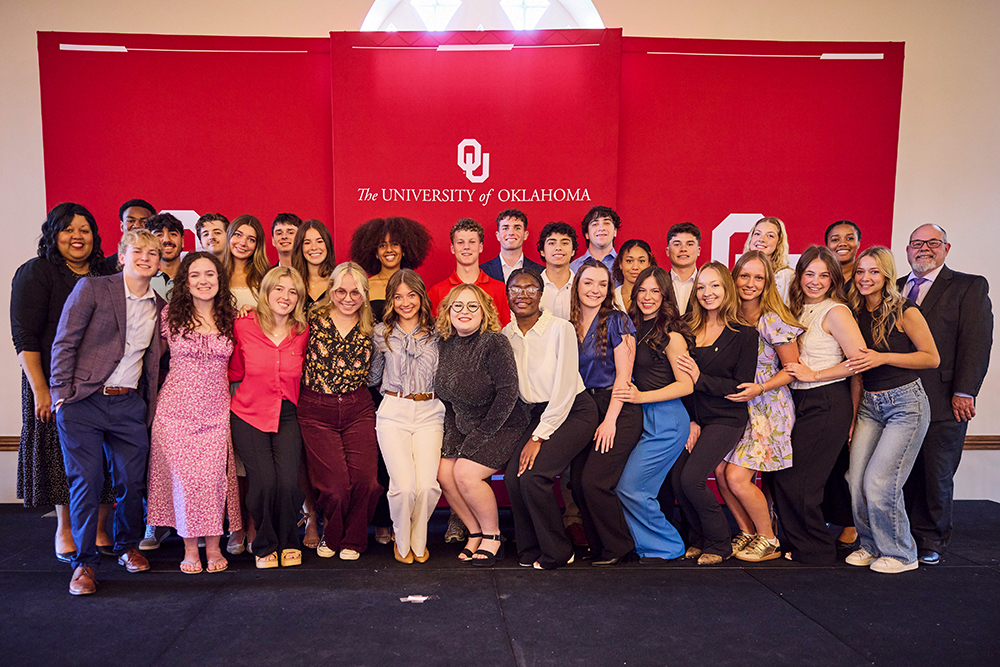 A group of students posing with awards.