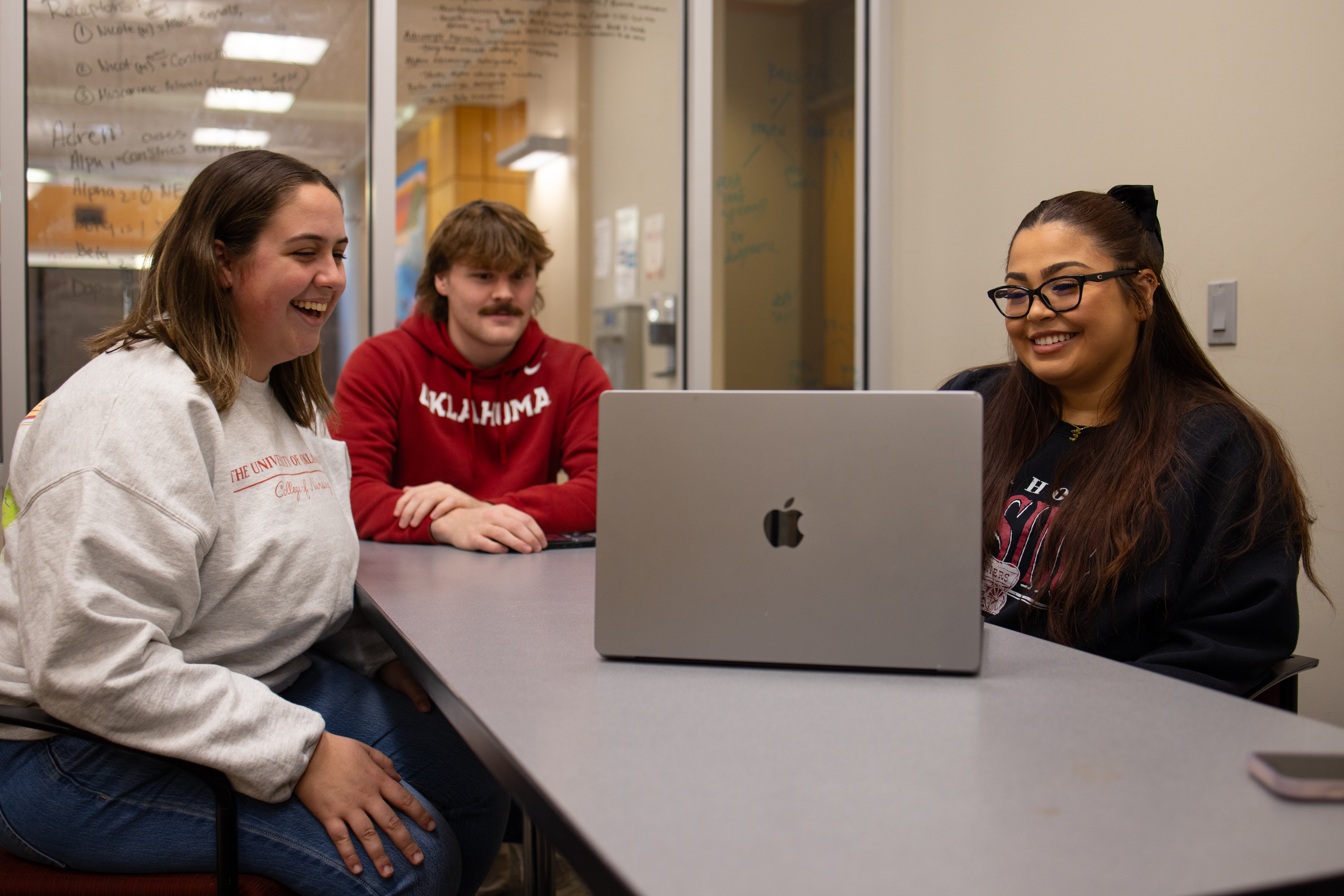 Students at a computer working together.