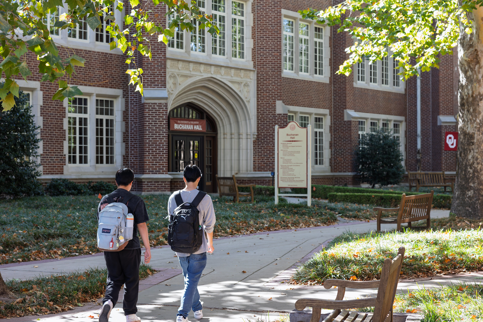 Two students walking outside of Buchanan Hall.