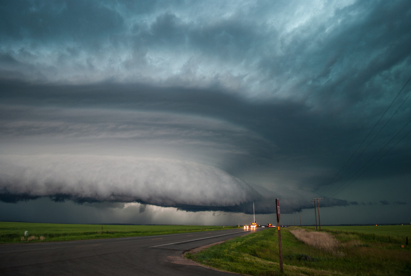 An impressive storm system with an aqua hail core and large wall cloud.