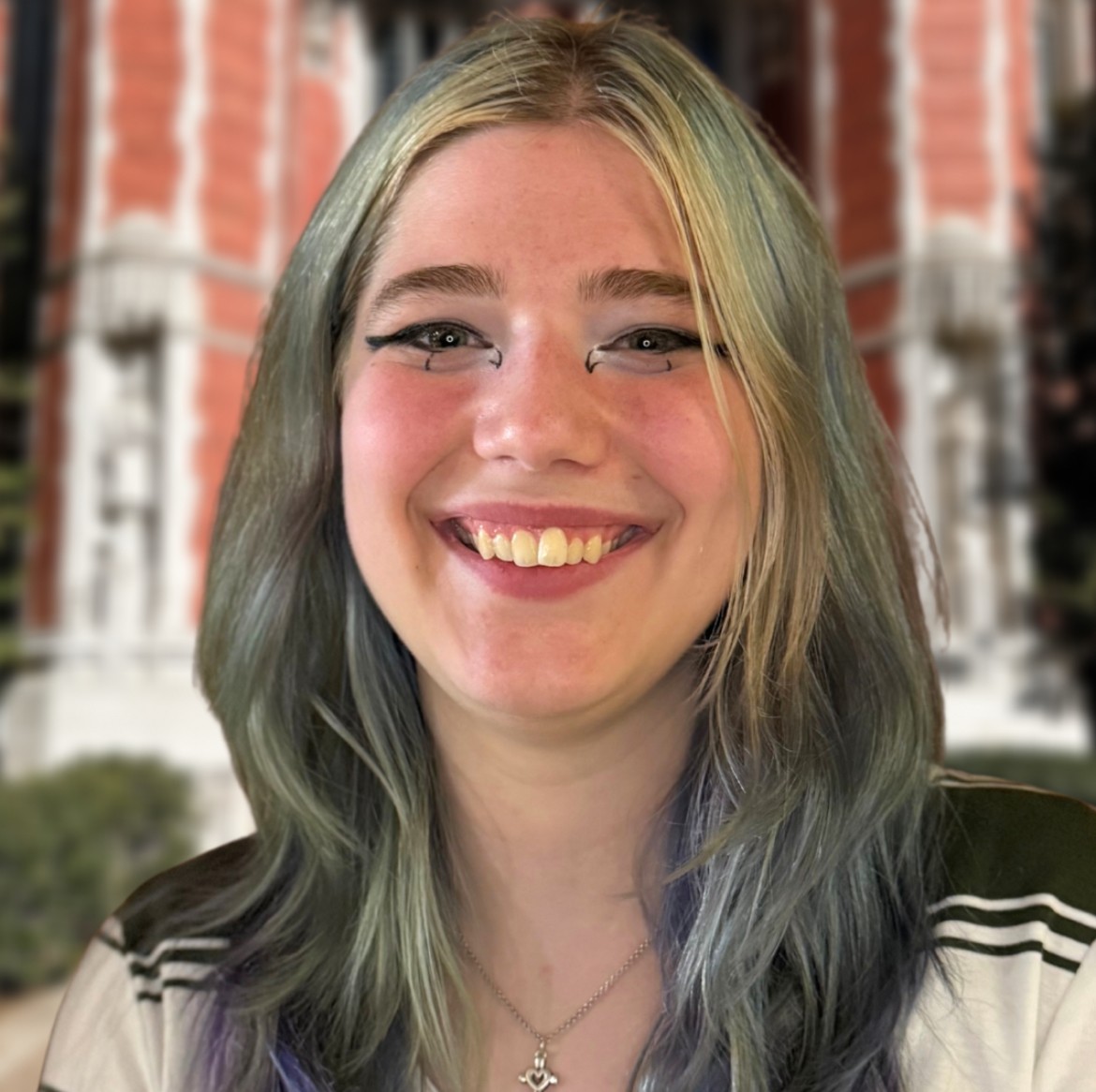 Kimberlyn smiling in front of the library