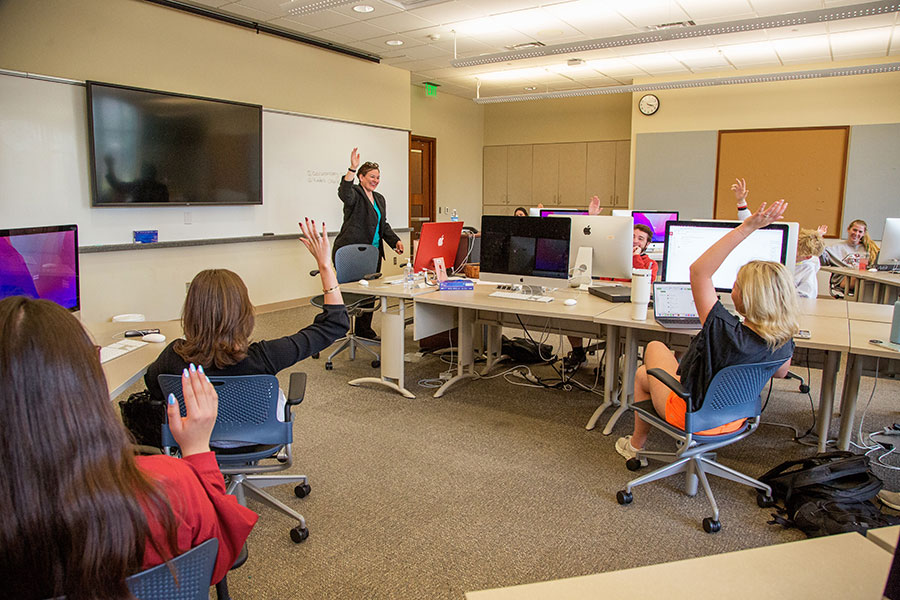 A professor is lecturing in a classroom.