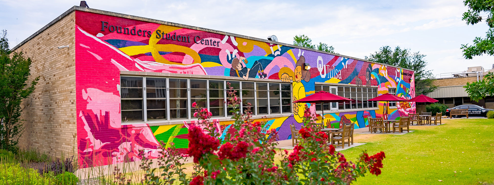 Bright red mural on side of building