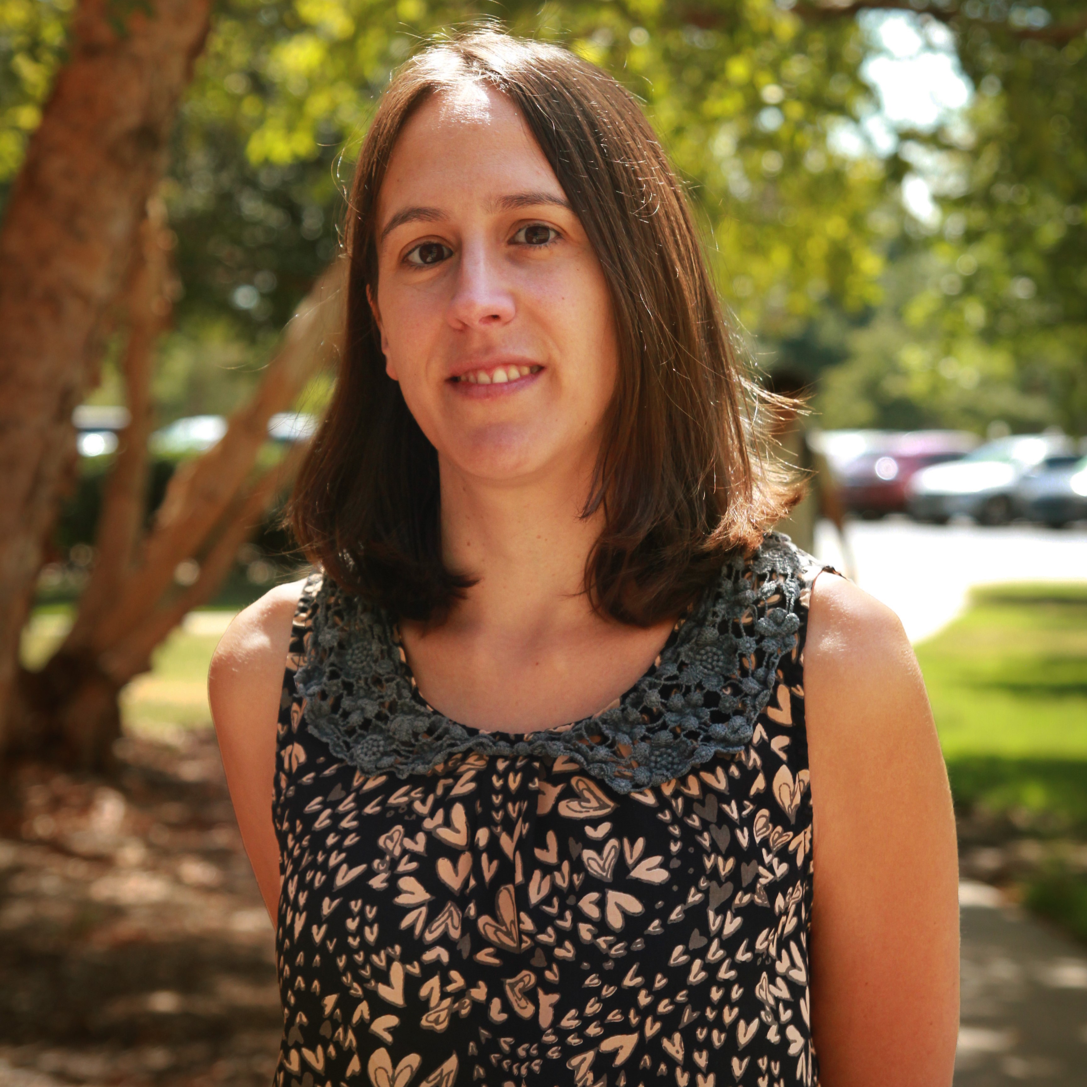 A person silhouette icon in white over a crimson background.