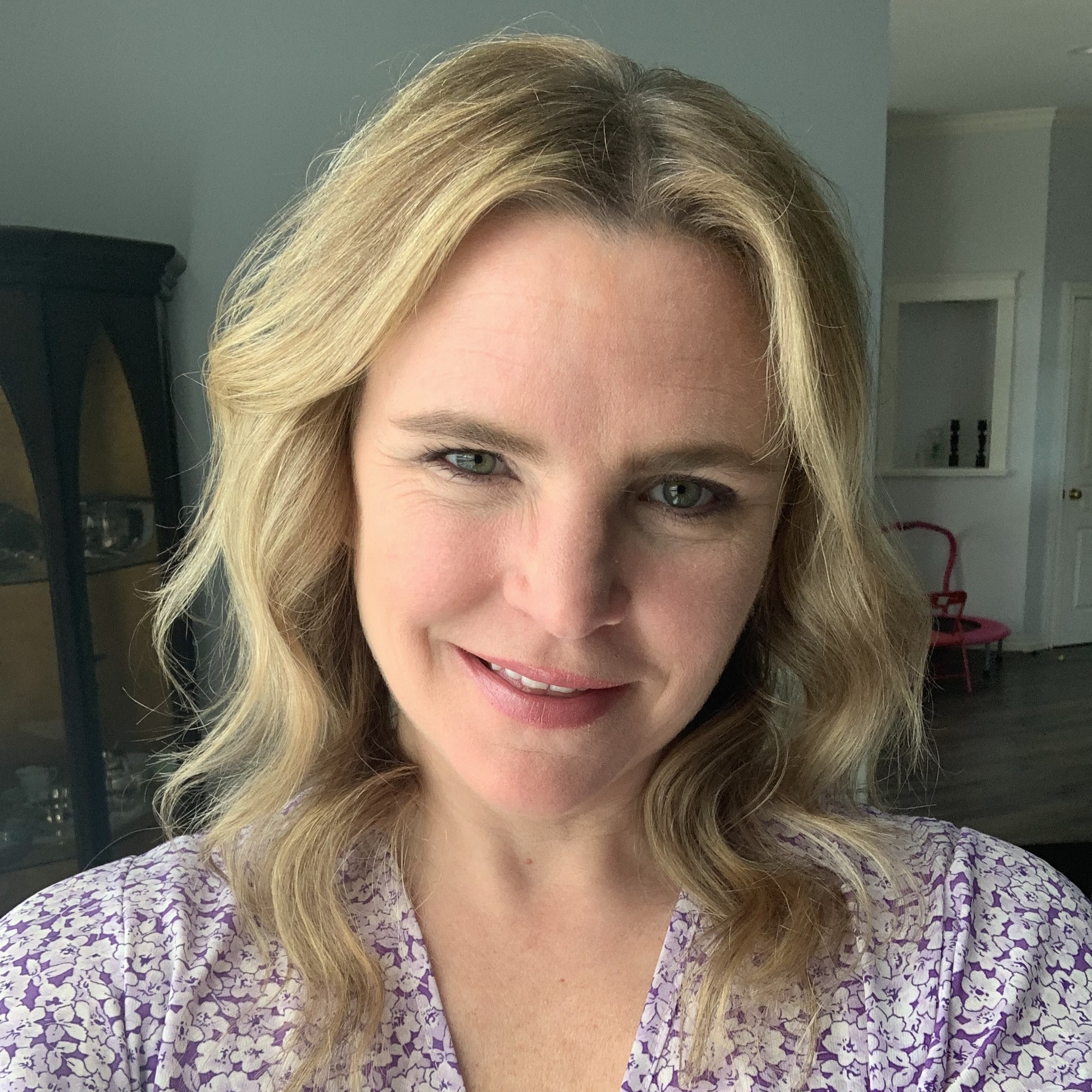 A person silhouette icon in white over a crimson background.