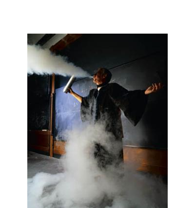 A photo of Stewart Ryan performing a physics demonstration in class.