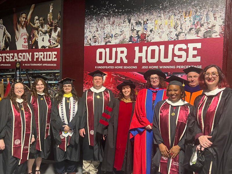 Museum Studies graduates and faculty members.