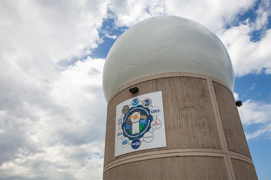 a phased array radar tower against a cloudy sky