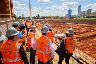 Group gathers around ground preparation for Innovation Hall construction in OKC. 