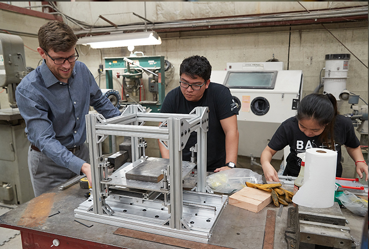 Faculty member and two students conducting component research in Fears Lab.
