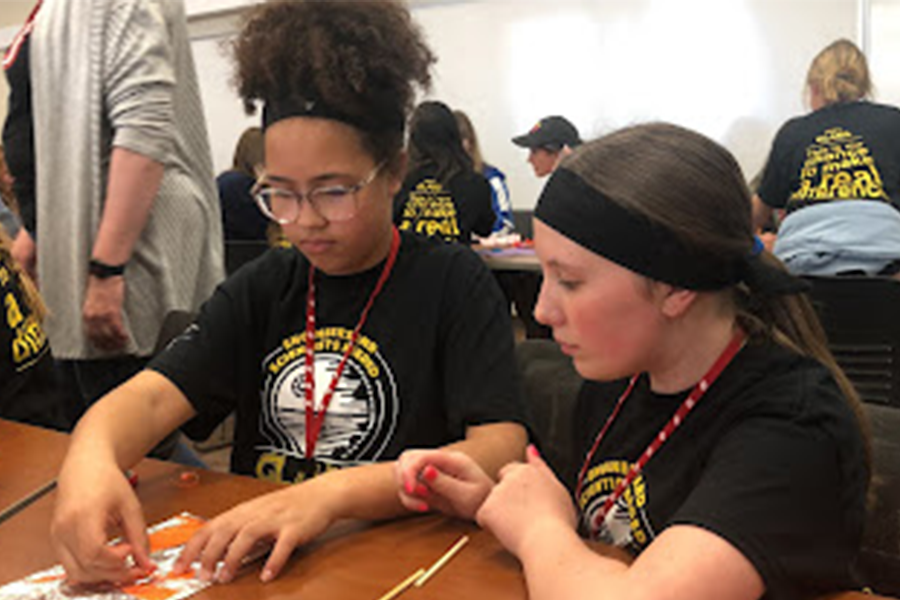 Two girls working on STEM project at GLAMS event