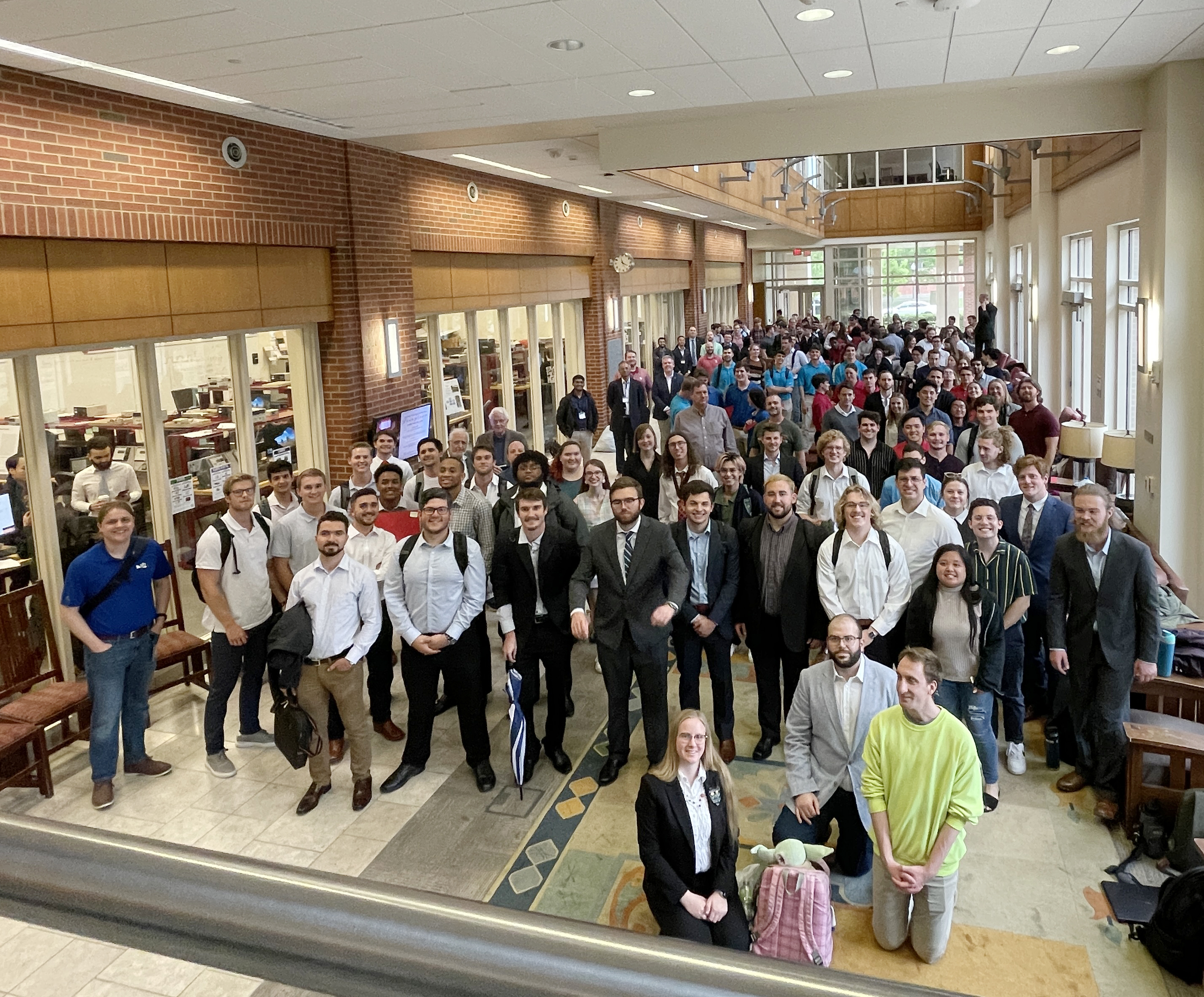 Capstone showcase attendees and presenters in the Devon Hall Atrium