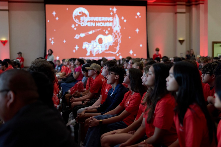Students sitting in an auditorium. 