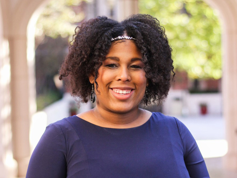 headshot of Jasmine Henry in a blue shirt