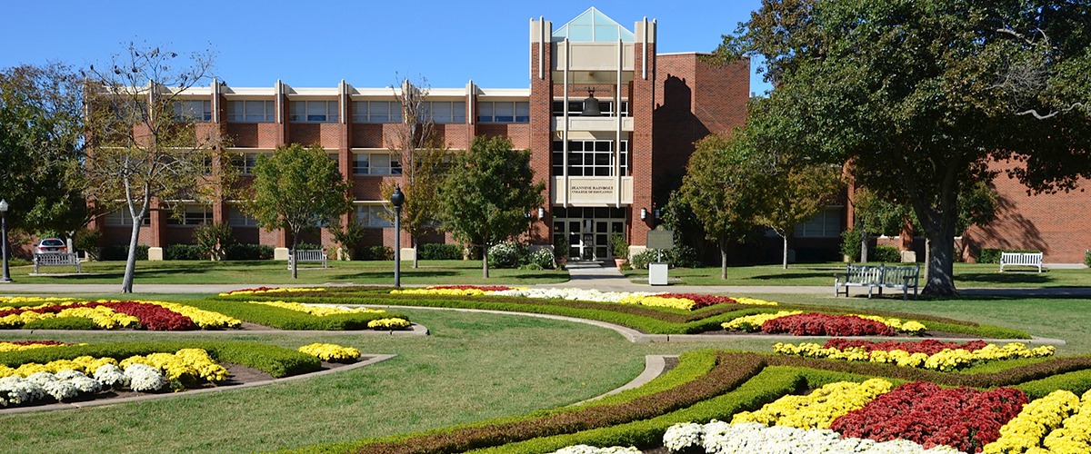 picture of the front of Collings Hall from across the South Oval