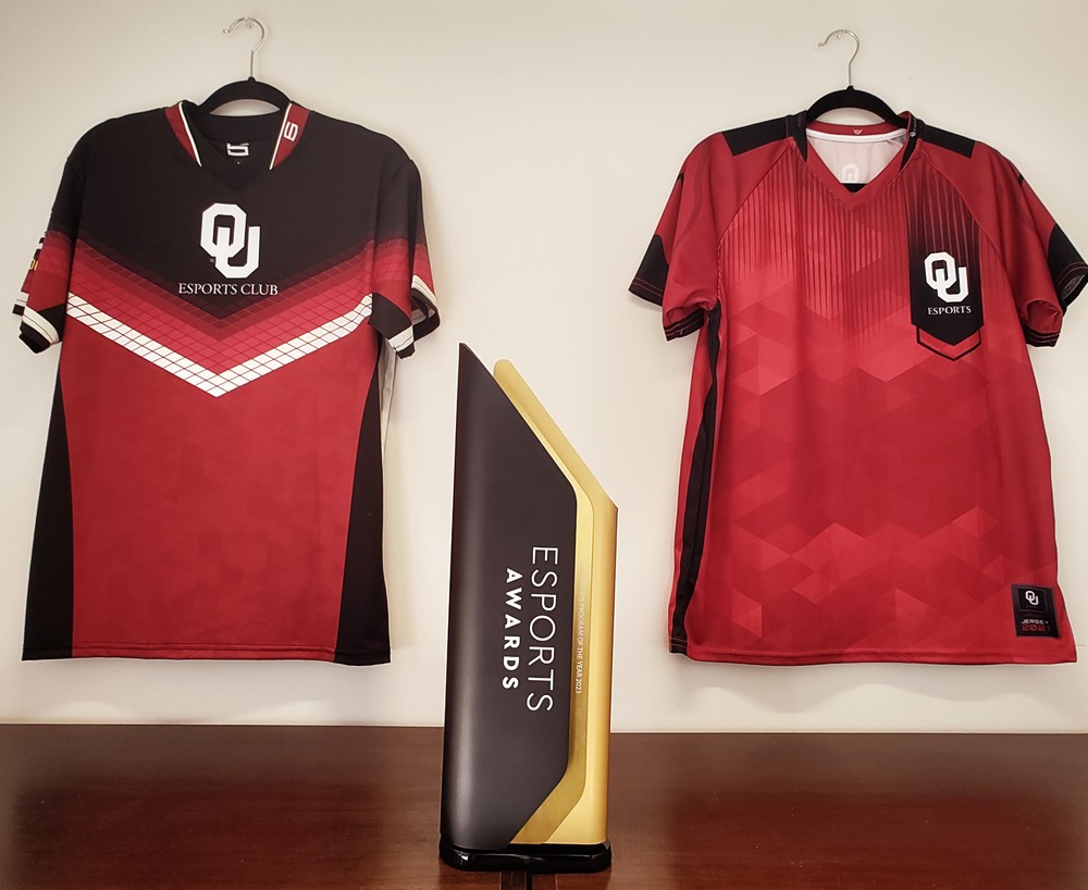 Collegiate esports award of the year with jerseys in background.