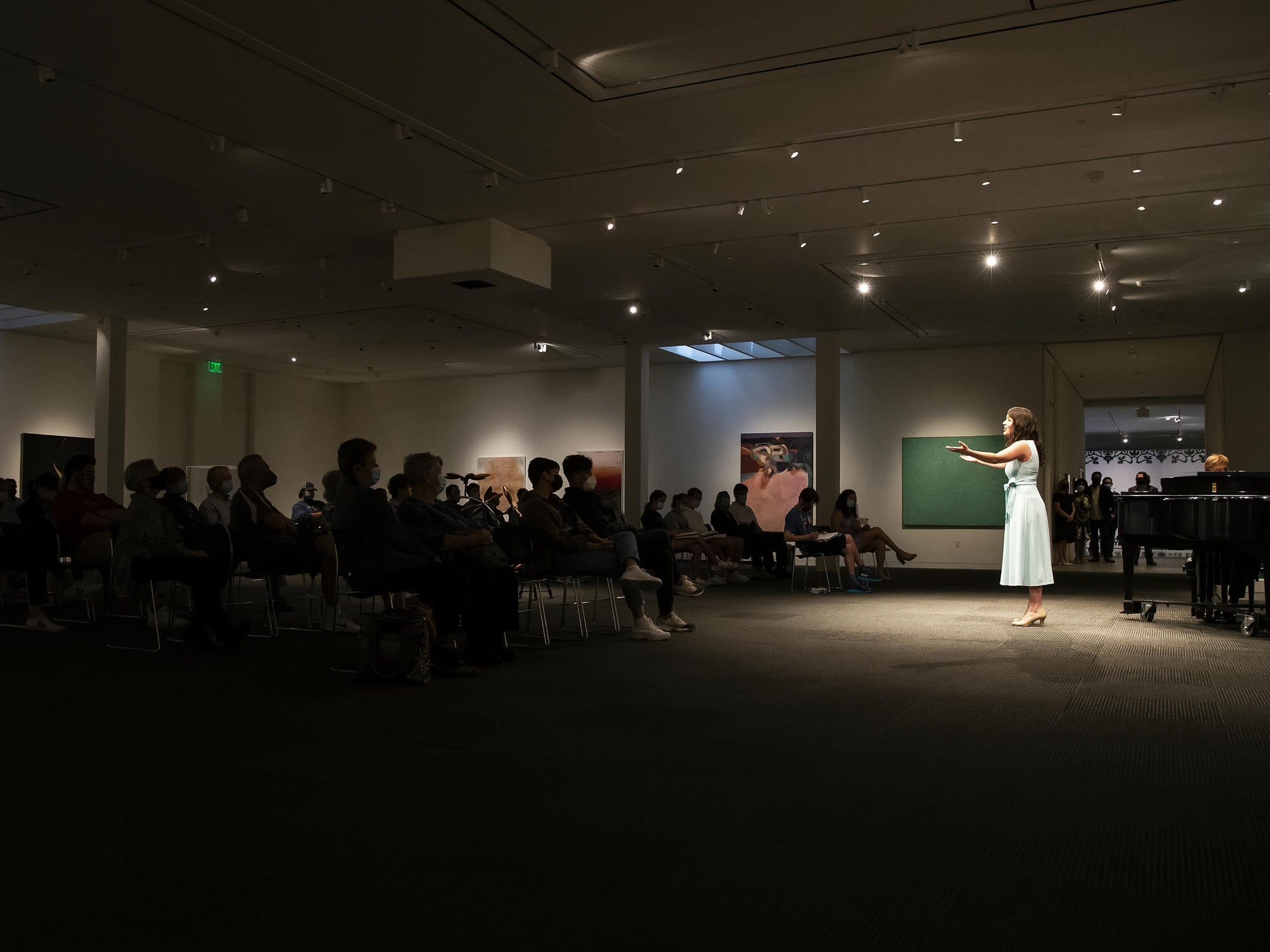 Voice Student performing in Sandy Bell Gallery in Fred Jones Jr. Art Museum.