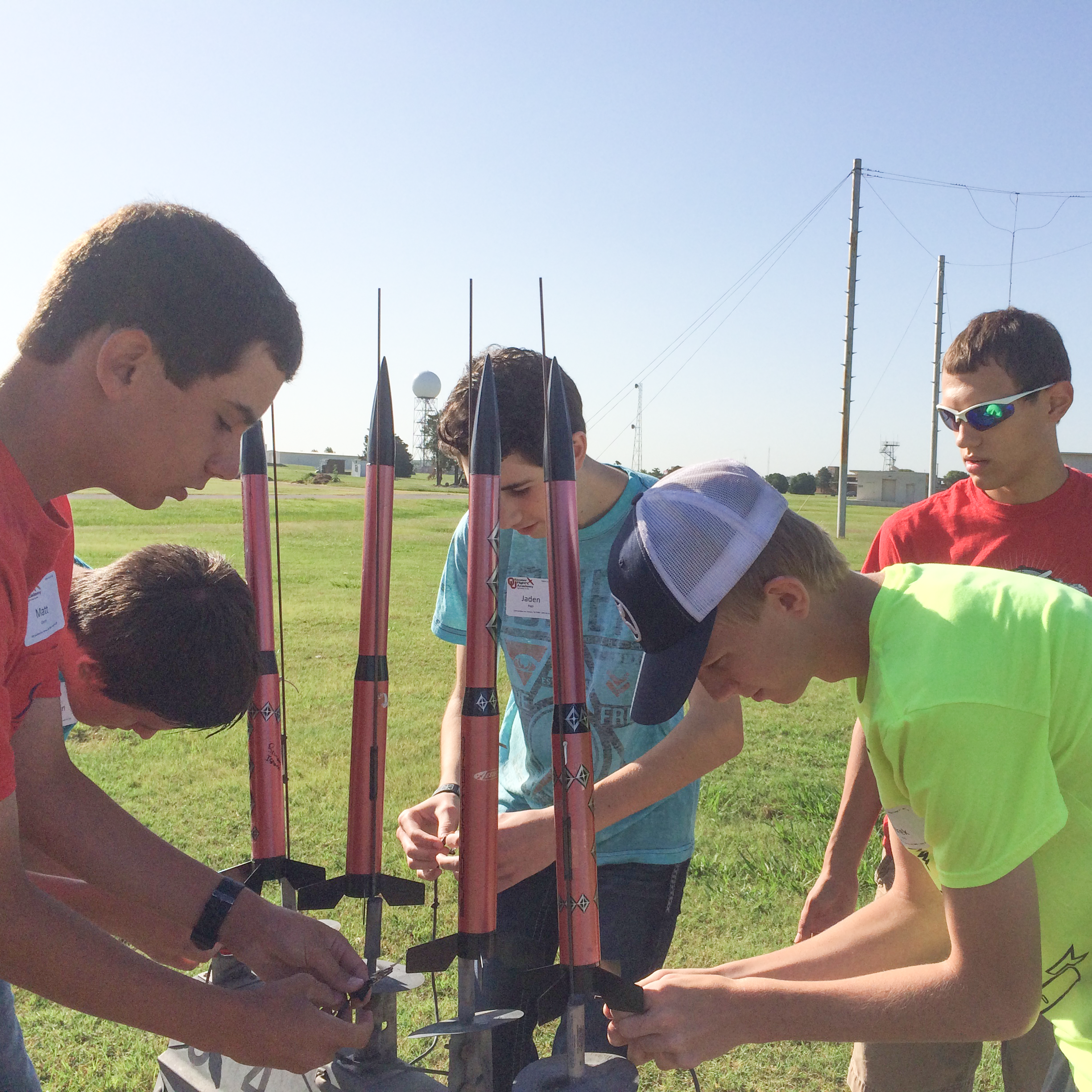 A group of teens participate in a rocket lauch activity