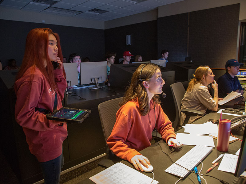 Students working in the control booth