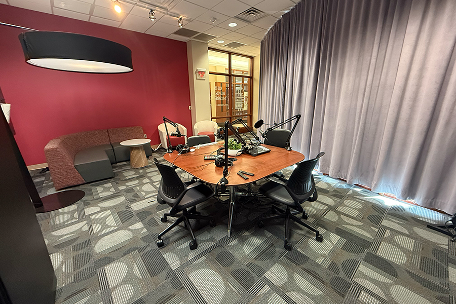 The Dean's Office Boardroom, with a large table and several chairs in the center.