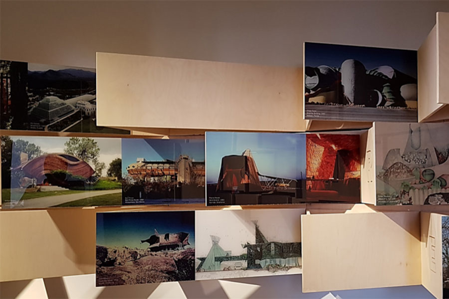 Wooden panels showing key works from the American School of Architecture.