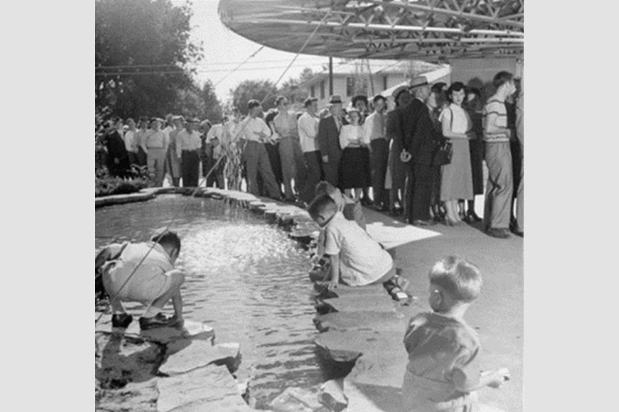 A historic photograph of visitors to a building by Bruce Goff.