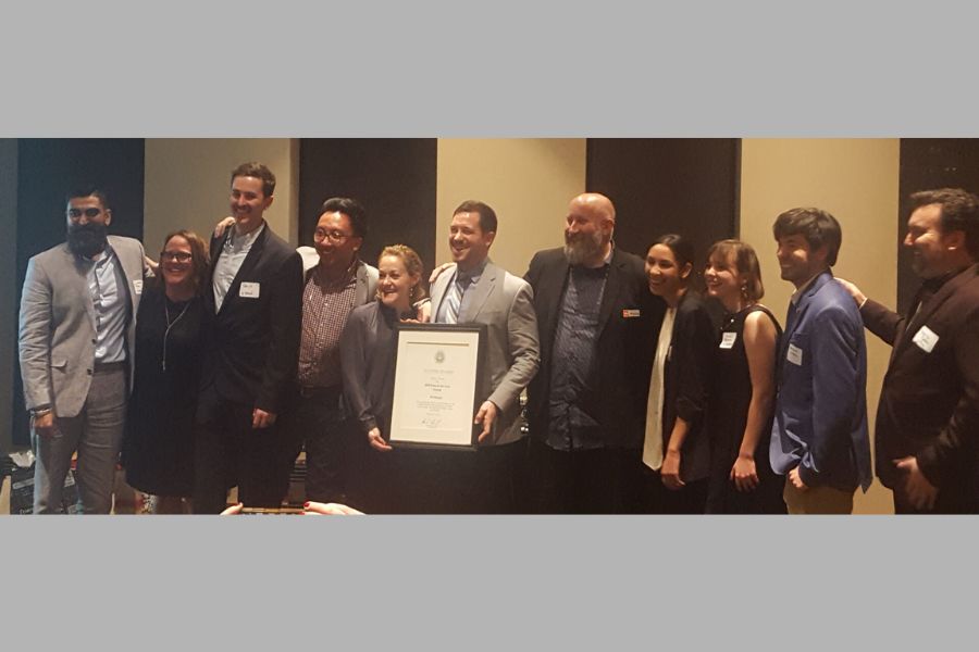 Group photo of W Design Team, and O U alumni Weldon Bowman, with firm award. 