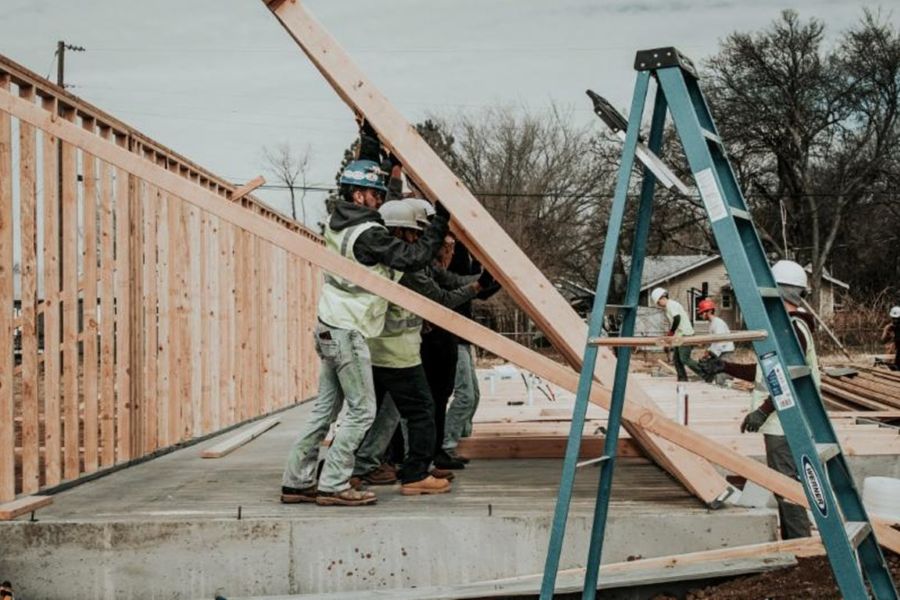 Students raising a wall.