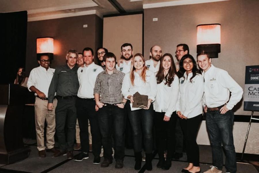 The first-place team with their award.