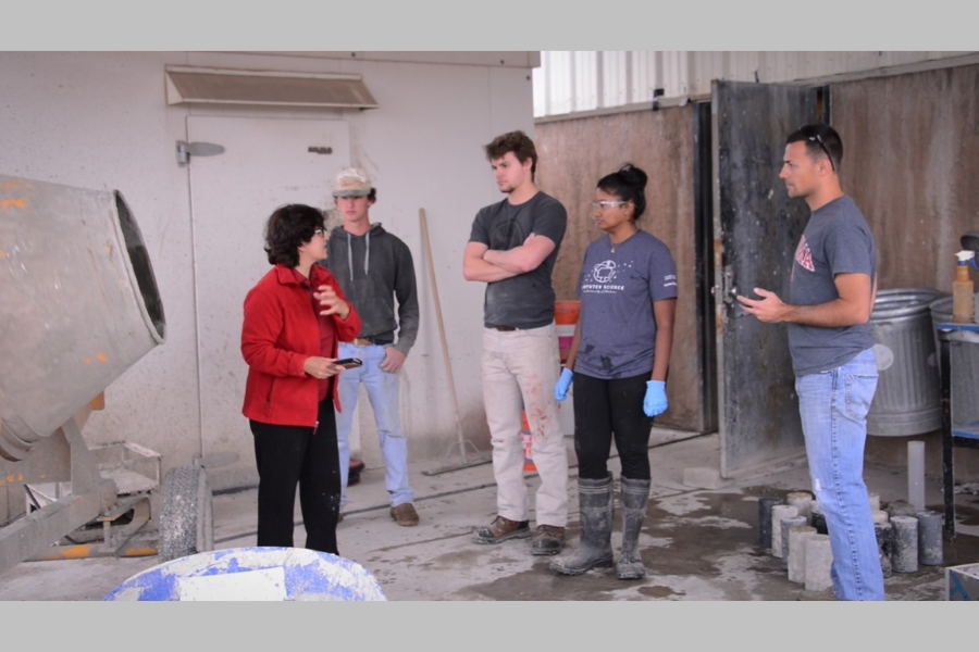 Dr. Shideh Shadravan and students testing concrete.