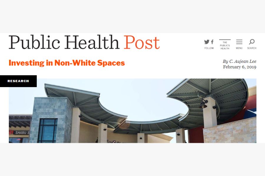 Header of a Public Health Post article titled "Investing in Non-White Spaces" by C. Aujean Lee, featuring a photo of a modern commercial shopping center with a curved metal canopy structure