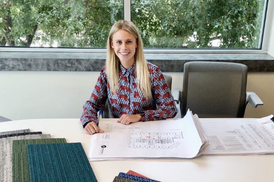 Photo of Ryan McNitt sitting at a table with plans