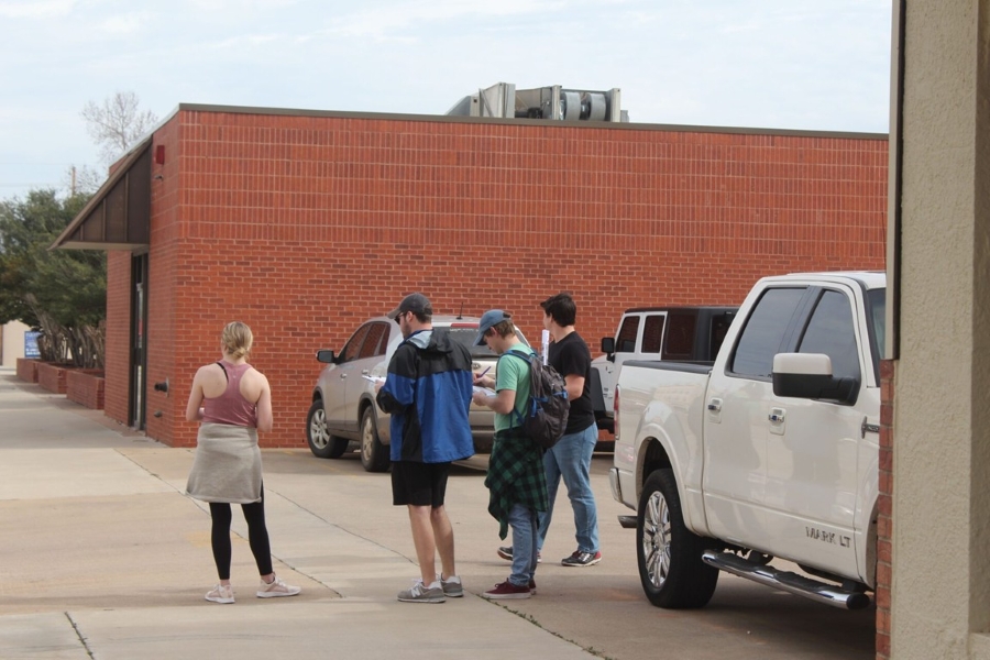 Students complete a parking survey in Chickasha, Oklahoma.
