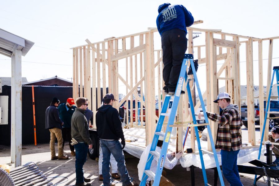 Students building the wood frame for a tiny home