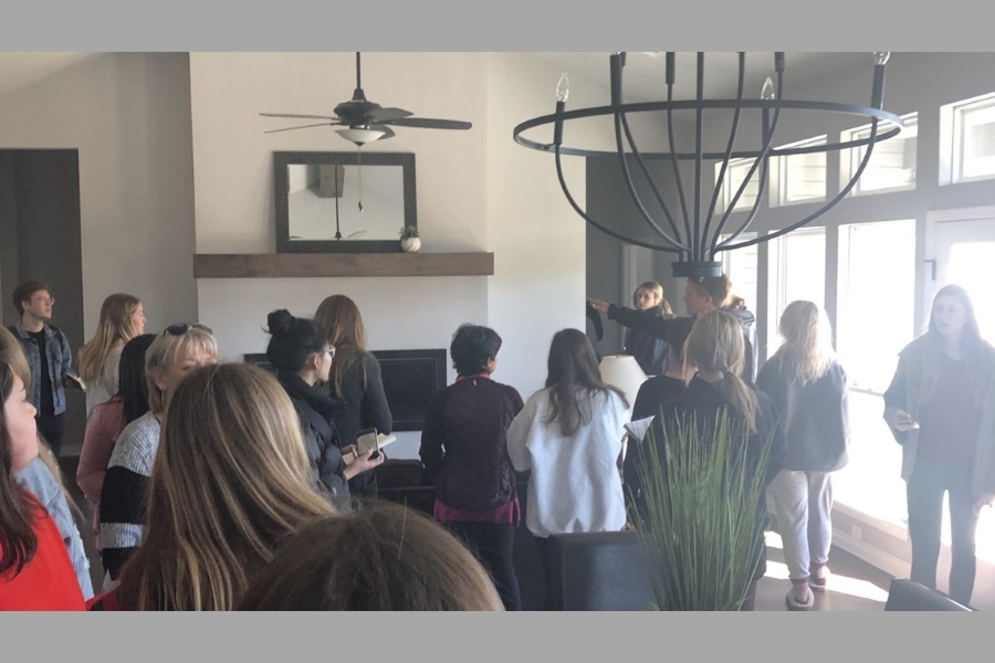 Interior Design students inside home completed by IDEAL Homes.