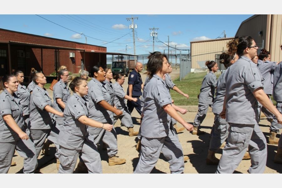 Women are shown marching around the Eddie Warrior Correctional Center.