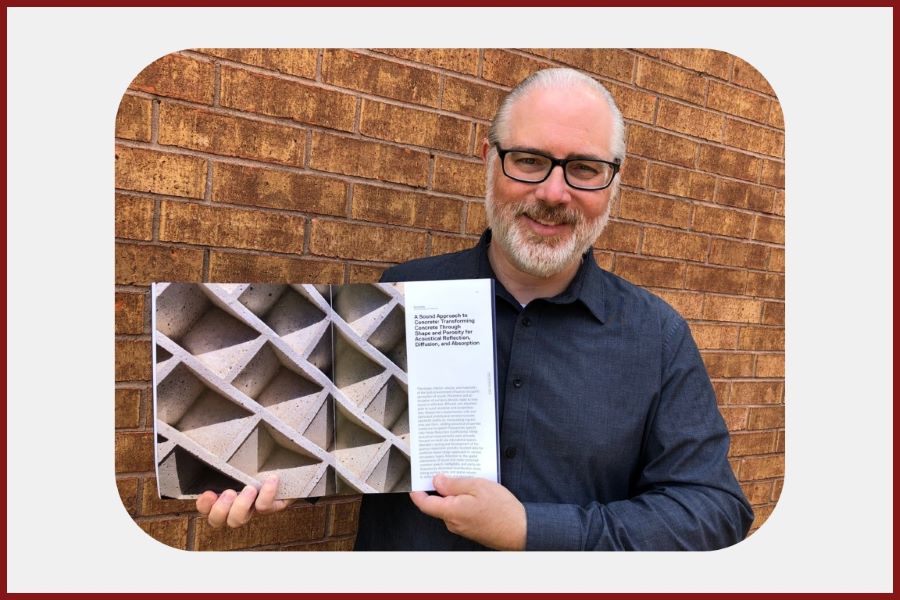 Daniel Butko displaying past publication.