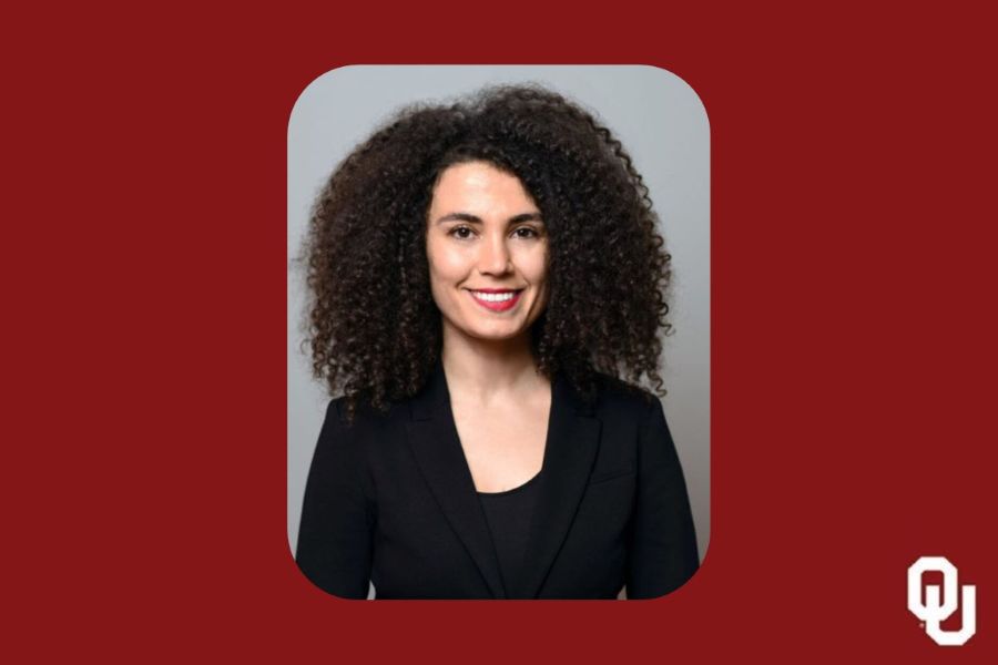 Esin Pektas with the O U logo.