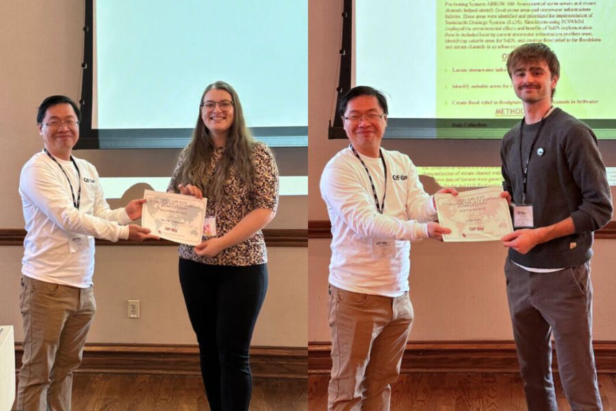 Gibbs students Daniela Kosnacova and Luke Kerr accepting G I S poster awards.