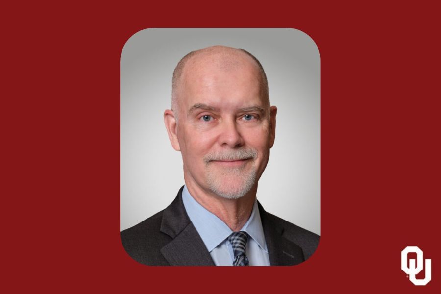 Michael McKelvy with the O U logo.