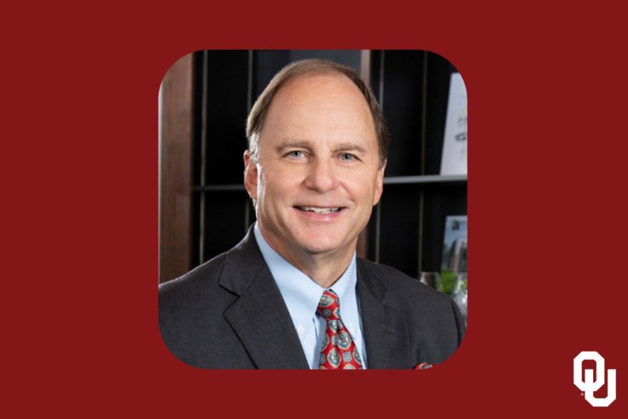 Raymond Harris with the O U logo.