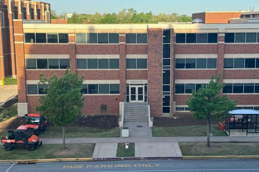 Gould Hall with landscaping vehicles and fresh soil.