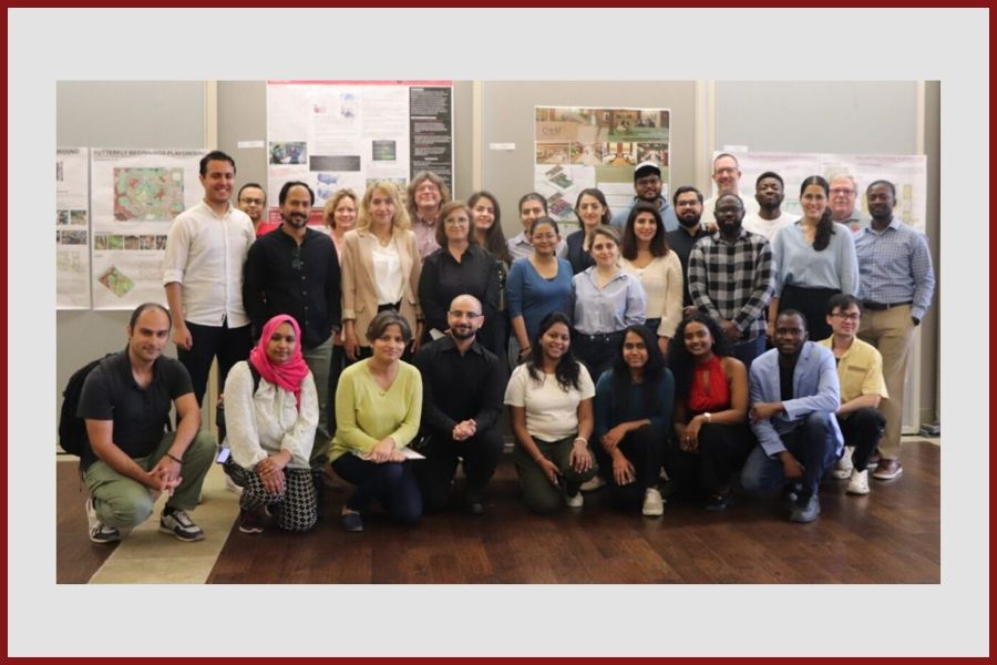 Gibbs College of Architecture graduate students in front of research posters.