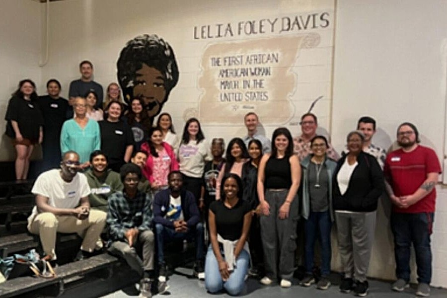 Planning students in Taft, Oklahoma in front of a banner of Lelia Foley Davis, the first African American Woman Mayor in the United States.